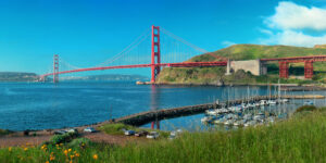 San Francisco skyline featuring the Golden Gate Bridge, hilly streets, and waterfront views representing a walkable car-free travel destination in the USA.